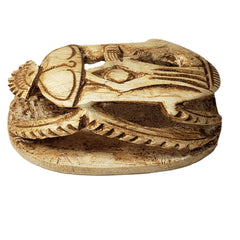 Wooden carvings with intricate patterns on a white background