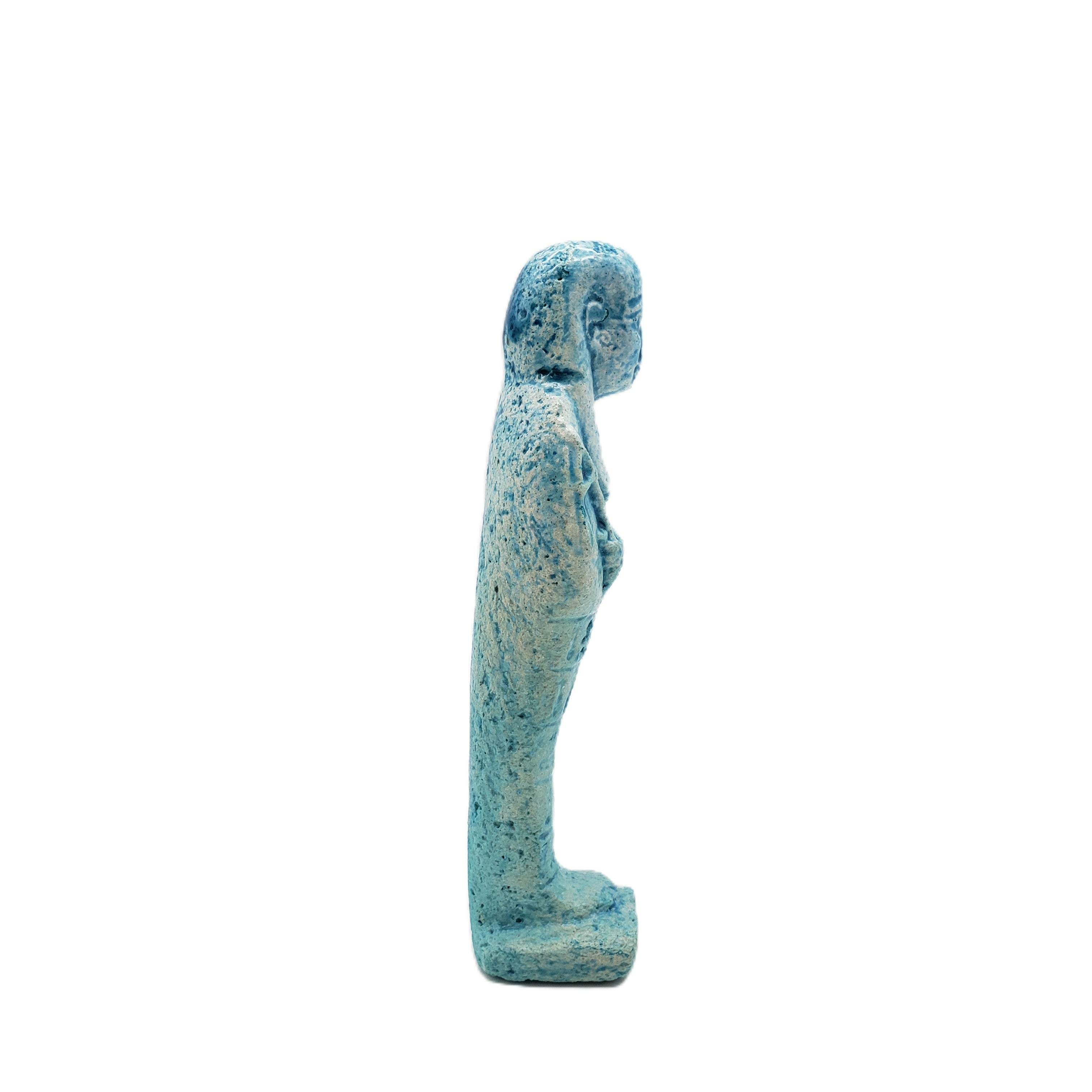 Statue of a Egyptian ushabti in a blue color on a white background