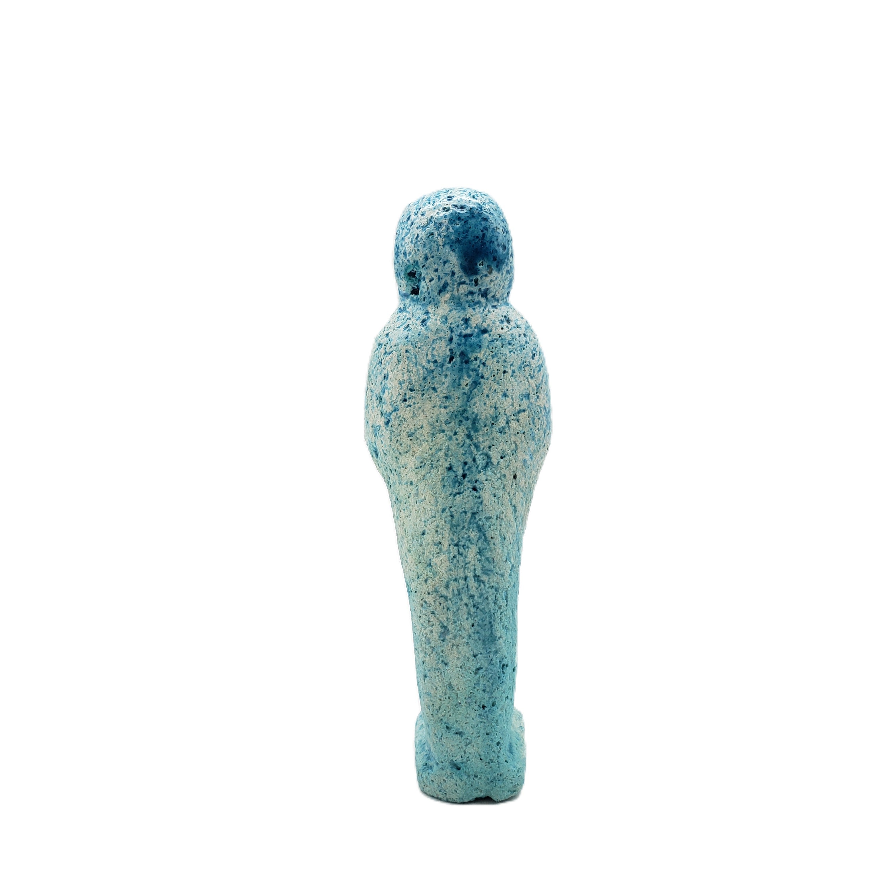 Blue and white speckled ceramic Egyptian ushabti on a white background