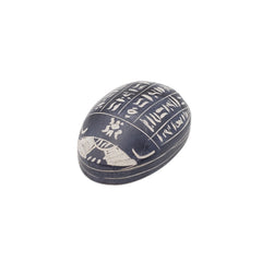 Decorative scarab with hieroglyphics on a white background