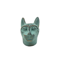 Vintage-style green cat head sculpture on a white background