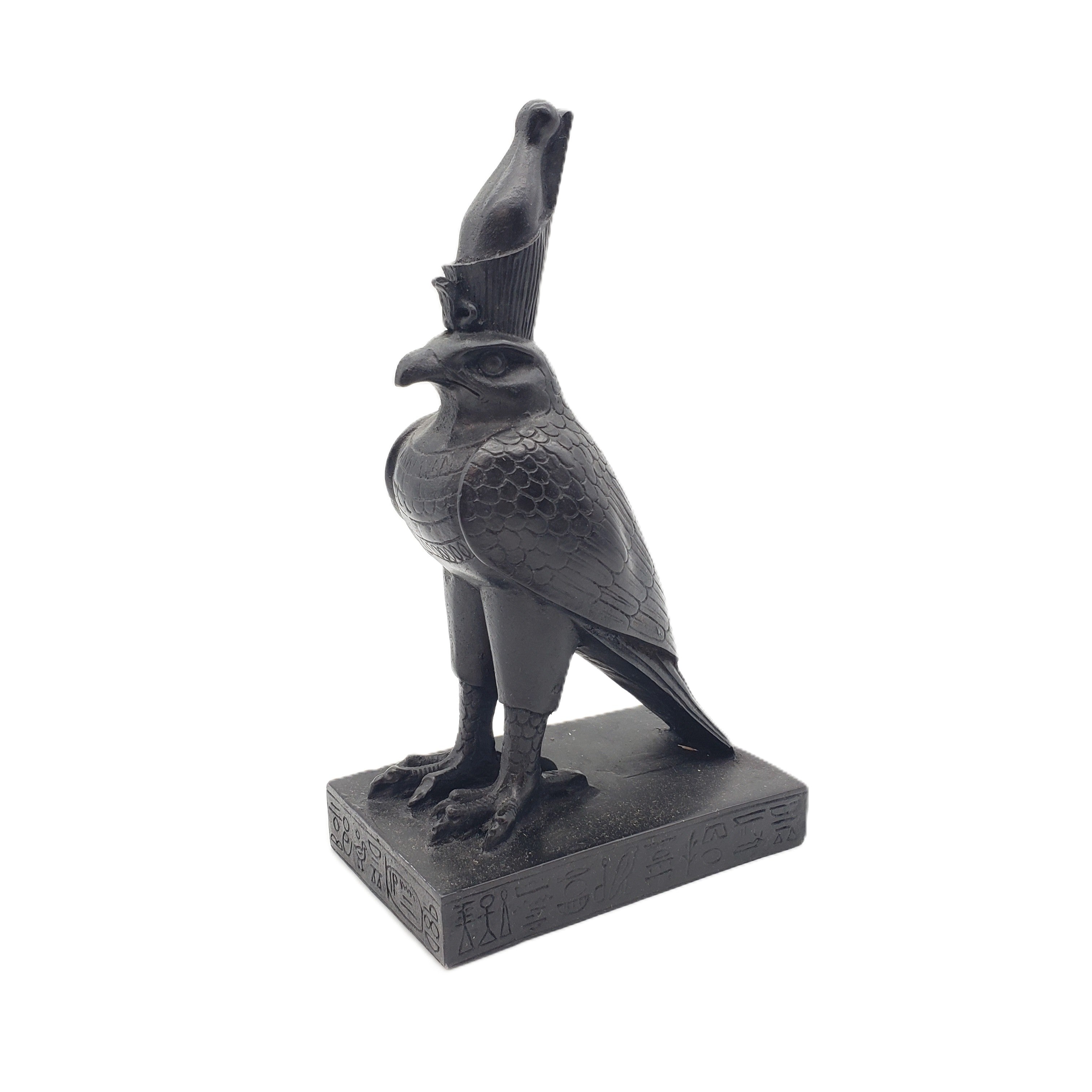 Statue of a falcon with a headdress on a white background