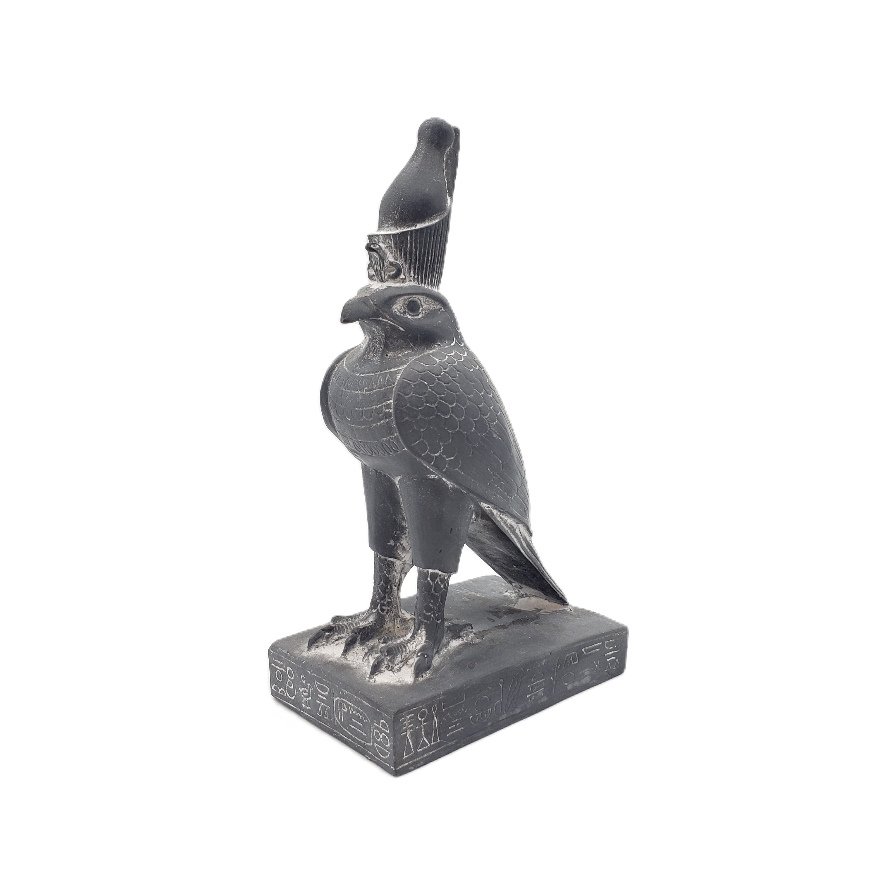 Statue of Egyptian falcon-god Horus on a white background