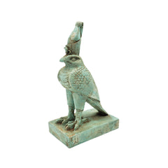 Statue of a Egyptian falcon-god Horus  with a headdress on a white background