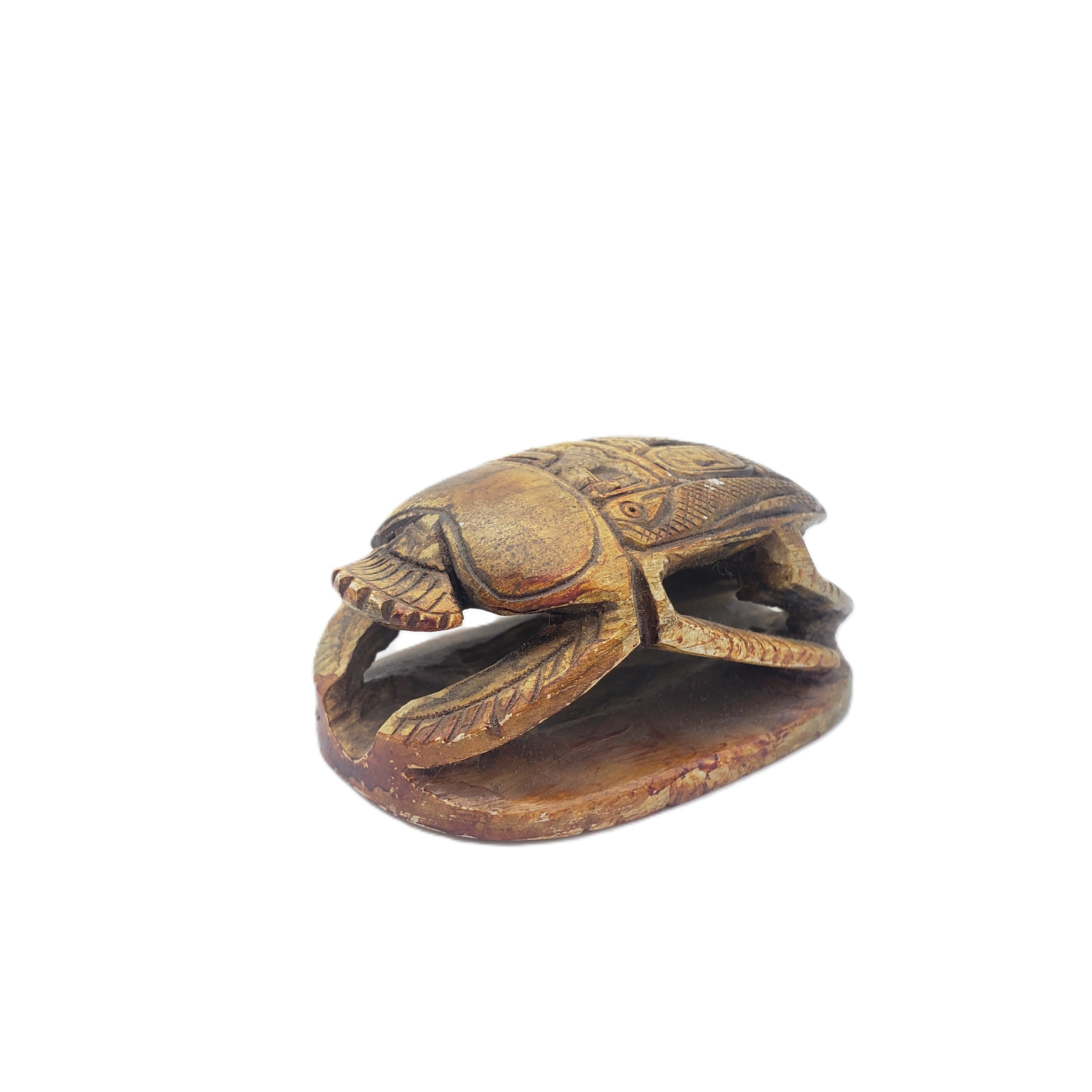 Egyptian scarab figurine on a white background