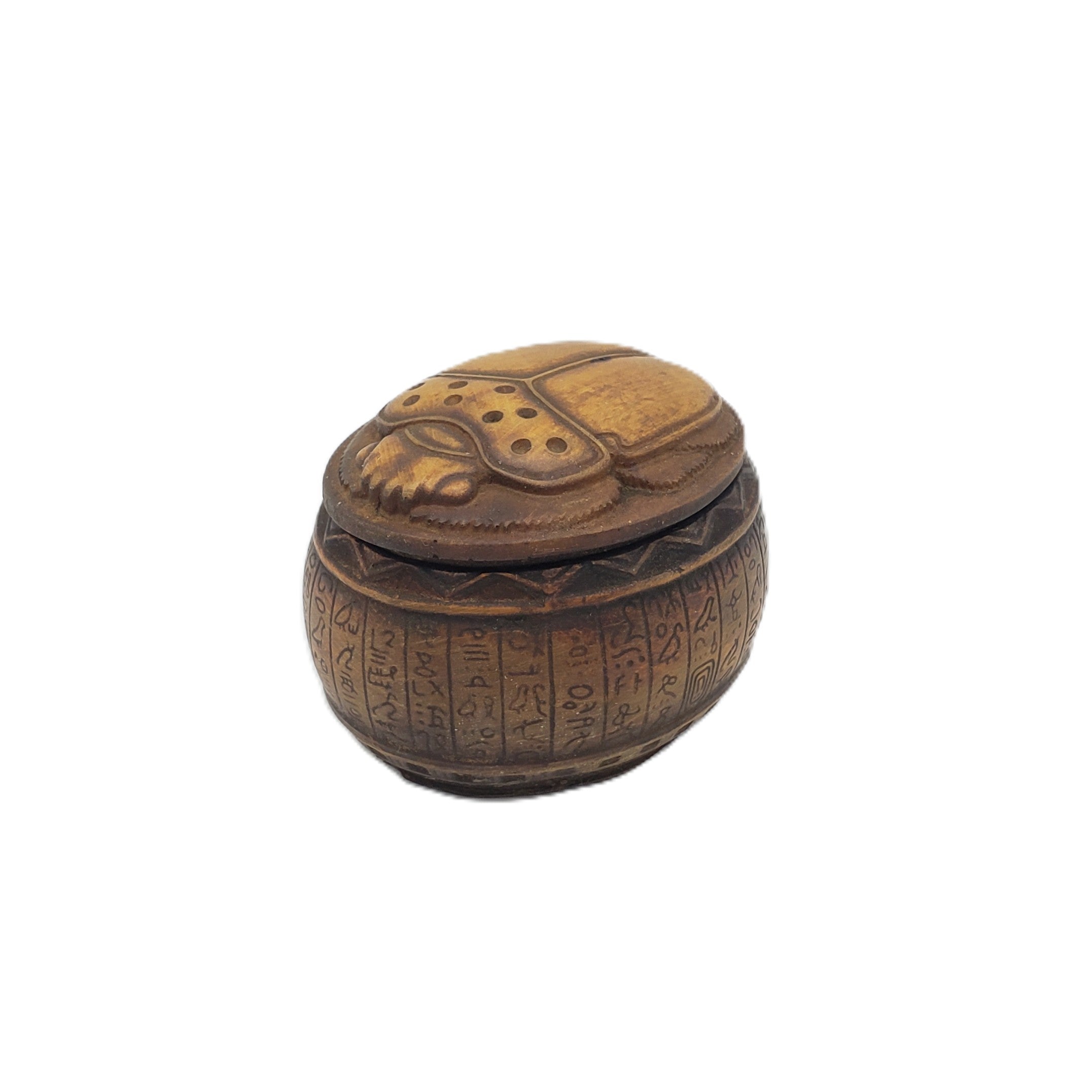 Decorative brown Egyptian scarab box with hieroglyphic designs on a white background