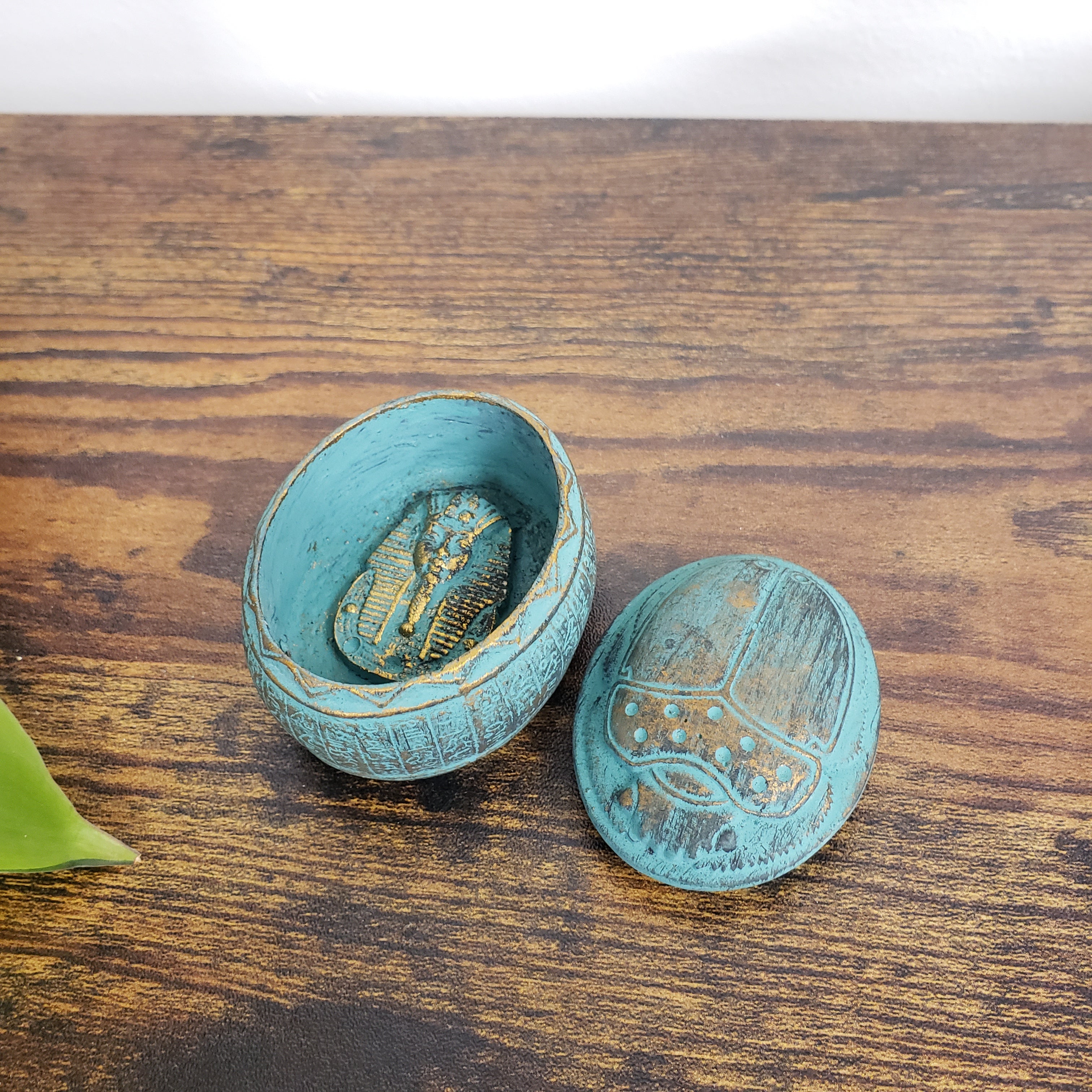 Egyptian scarab box on a wooden surface