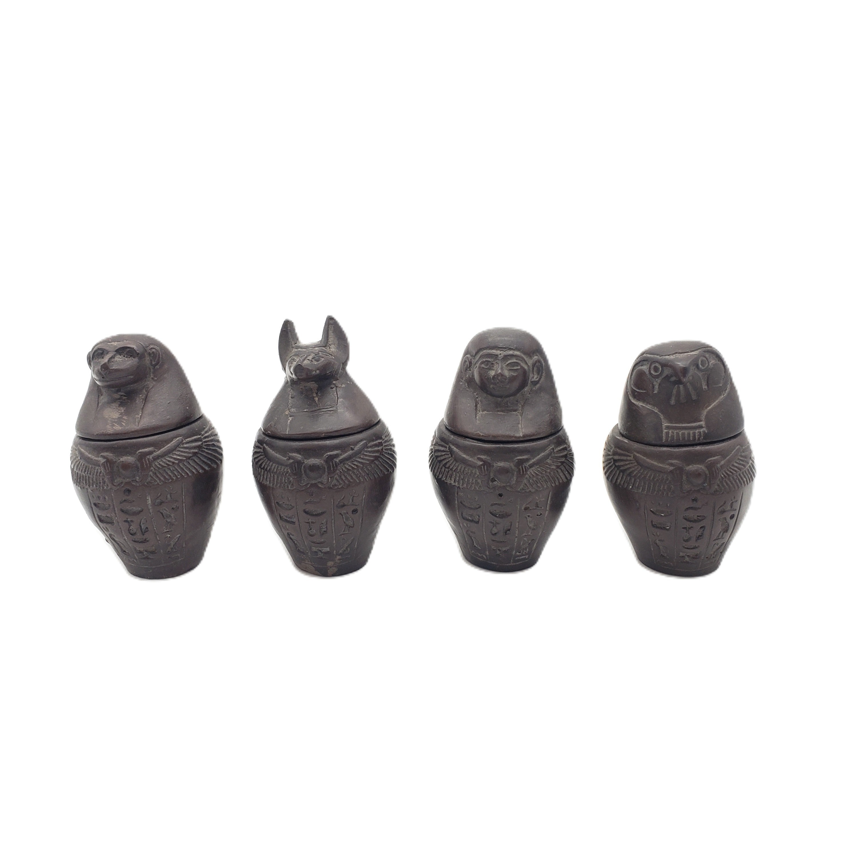 Egyptian-style canopic jars on a white background