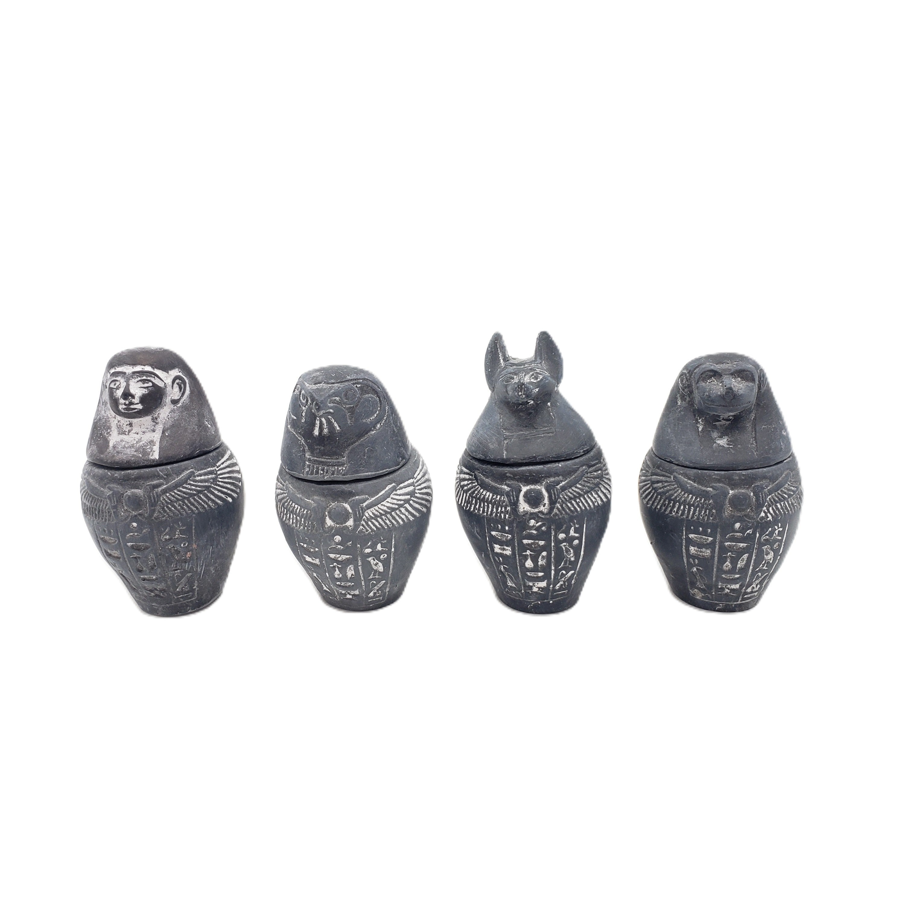 Egyptian-style canopic jars on a white background