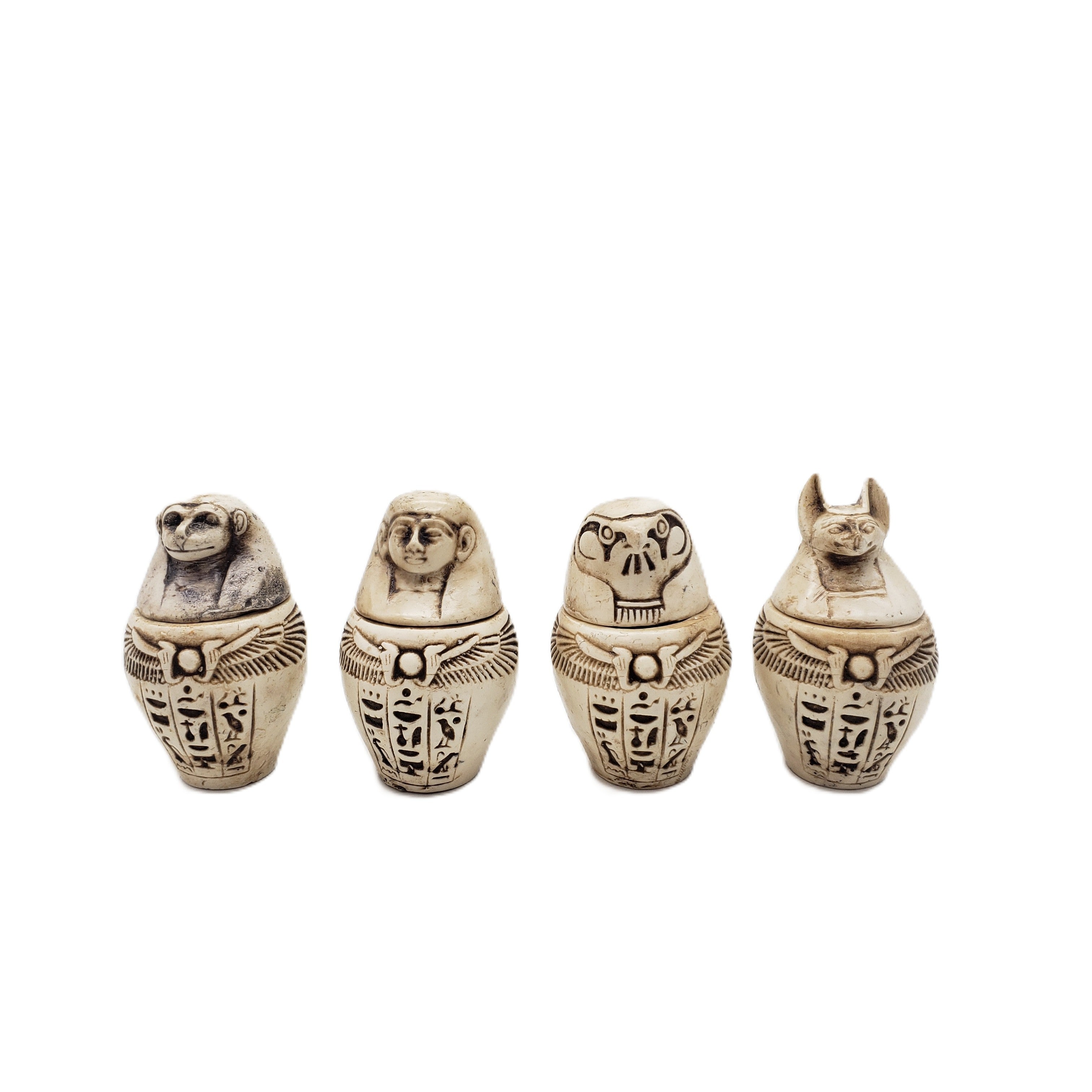 Egyptian-style canopic jars on a white background