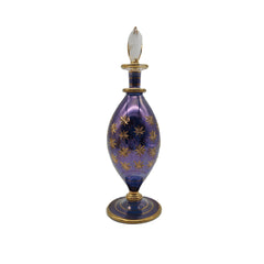 Decorative purple bottle with gold accents on a white background