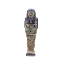 Decorative figurine resembling an ancient Egyptian mummy with blue and brown colors on a white background