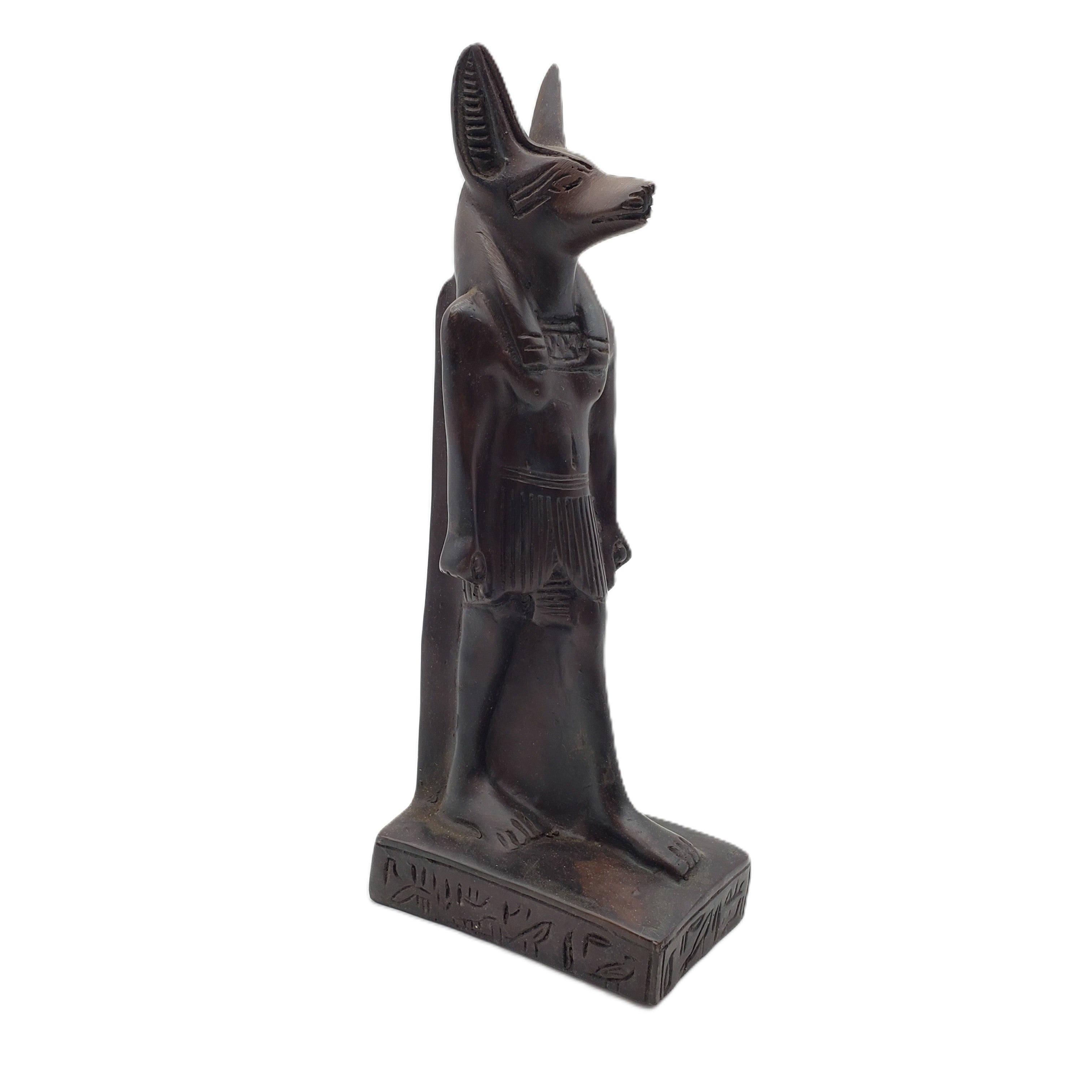An ancient Egyptian Anubis statue, depicted as a jackalope with a dark bronze finish, standing on a rectangular base with hieroglyphic details, set against a plain white background.