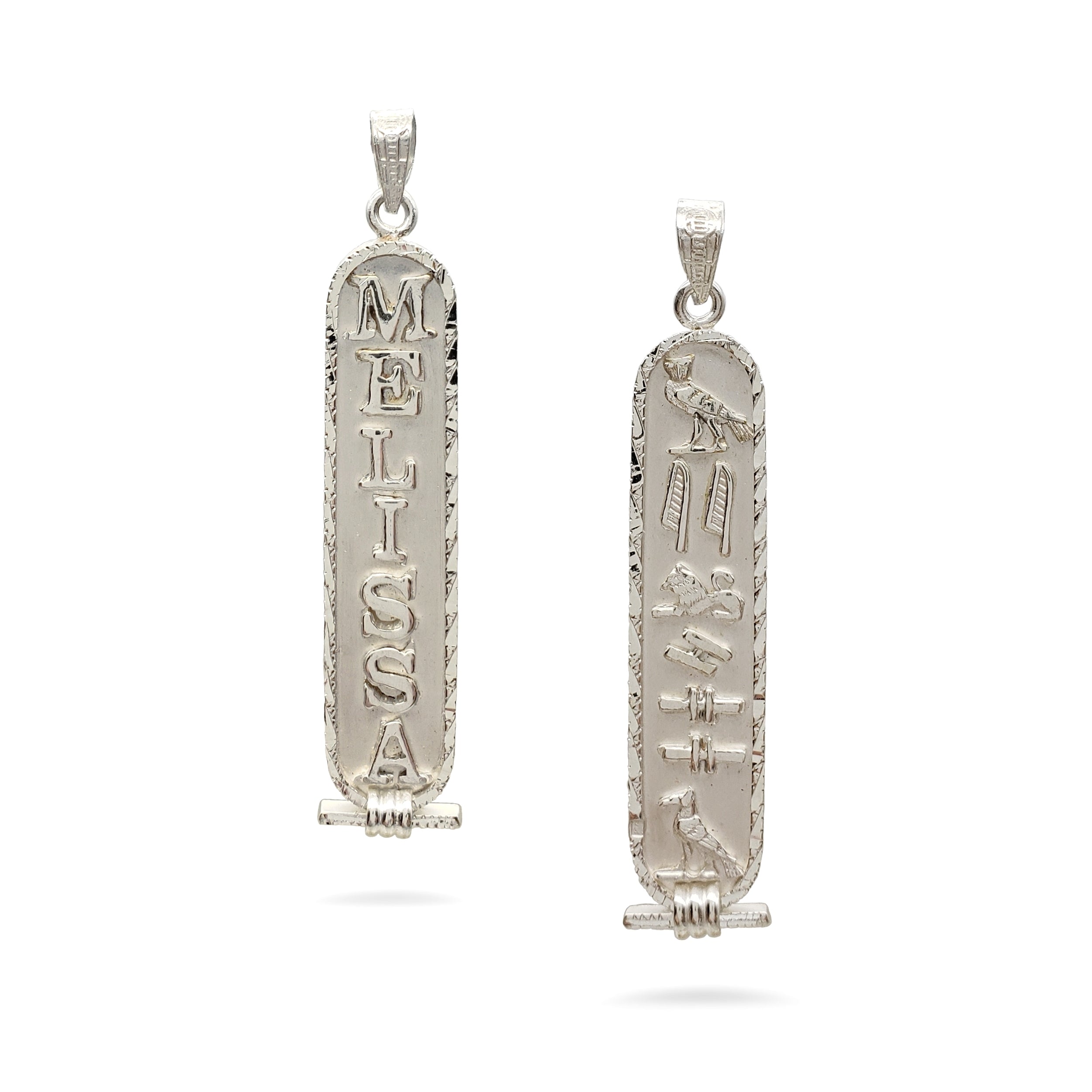 Two silver pendants on a white background
