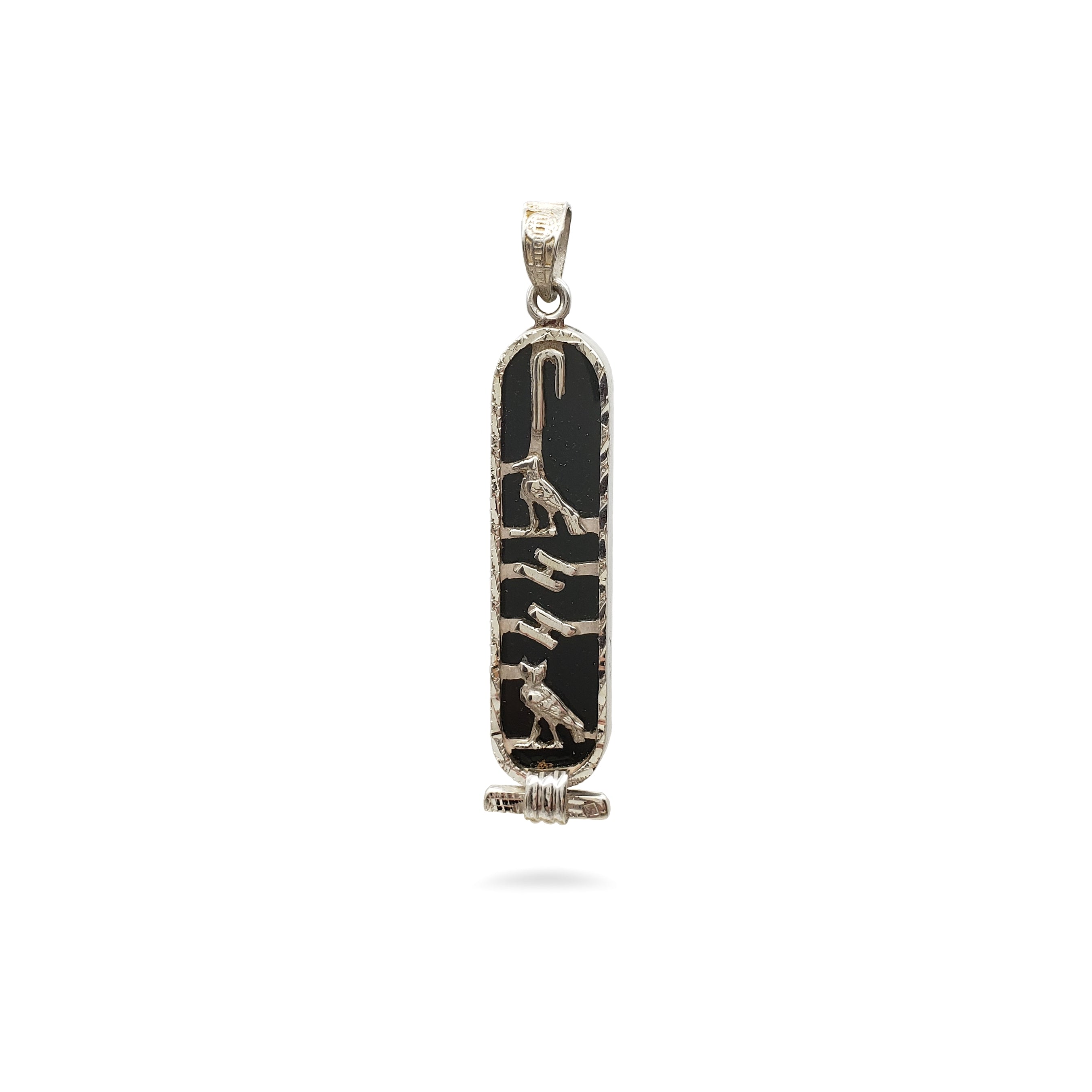 Decorative pendant with black and gold design on a white background