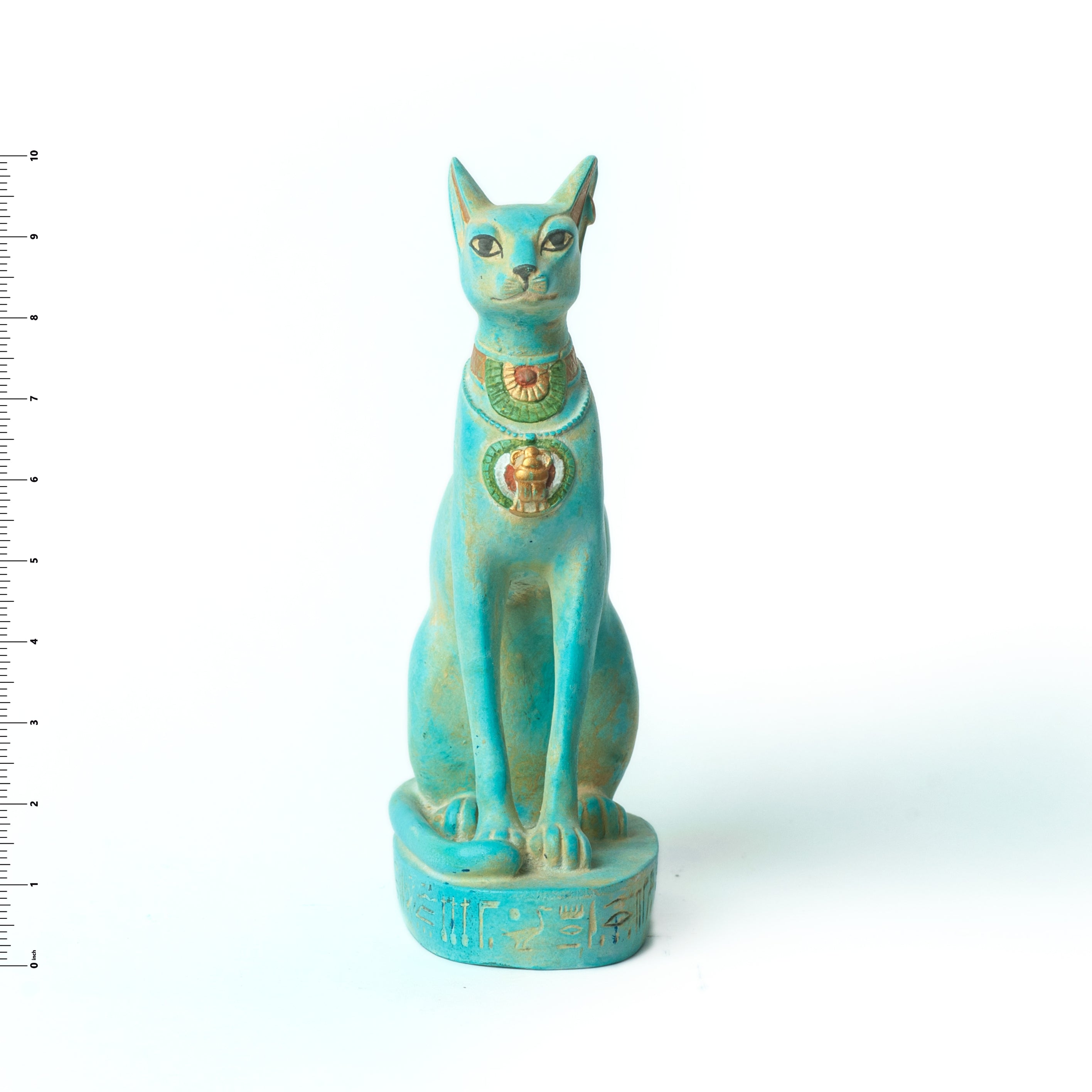 Turquoise Egyptian-style cat statue with decorative elements on a white background