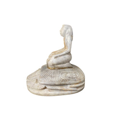 An Egyptian scarab statue with a pharaoh seated on top, featuring intricate carvings and hieroglyphs on the base.